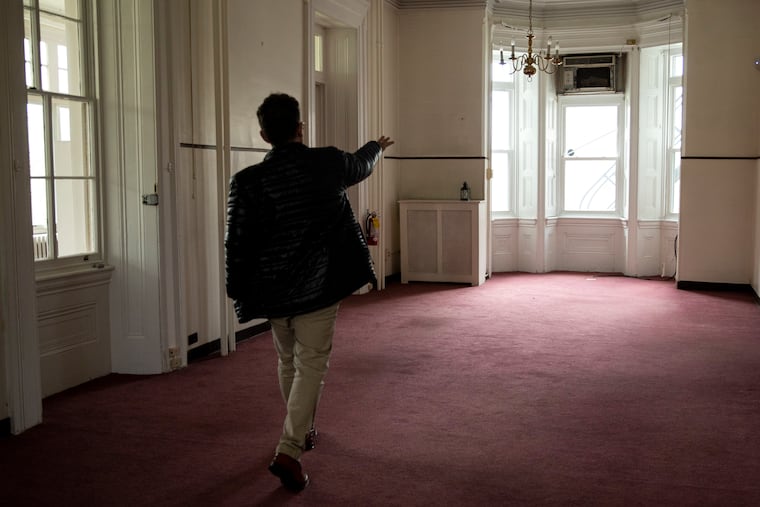 William Valerio, Director and CEO of Woodmere Art Museum, walks through the recently acquired historic mansion showing the rooms and spaces that will be converted and renovated, on Tuesday, April 19, 2022.