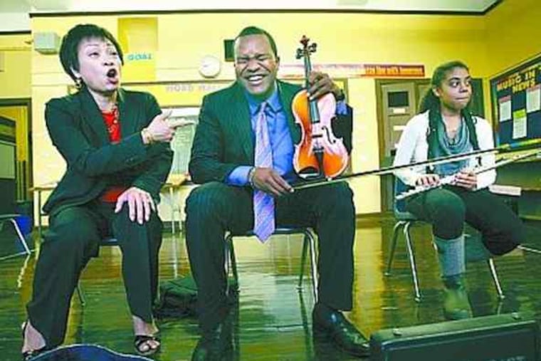 Rodgers with Virginia Lam (left), a School District content specialist in music education, and first-year teacher Morgan Stewart (right).