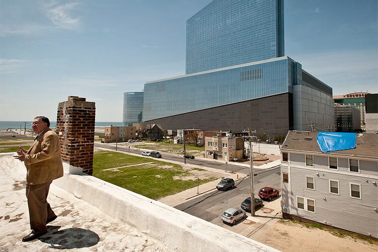 Charlie Birnbaum stands on the roof of his parents home at 311 Oriental Avenue in Atlantic City, overlooking the Revel casino.