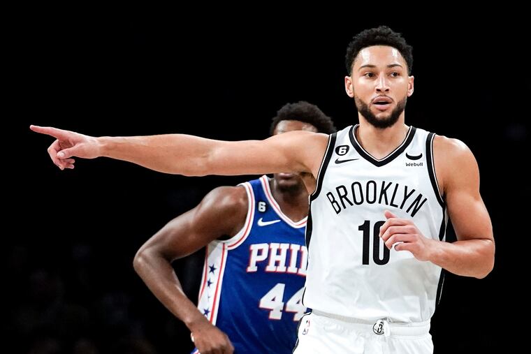 Brooklyn Nets guard Ben Simmons points during the first half of a preseason game against the 76ers.