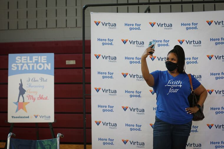 Nadeen Randall, of Sicklerville, N.J., poses for a selfie after she received her first dose of the COVID-19 vaccine at Tabernacle Baptist Church in Burlington, N.J., on March 21, 2021. The three-day “Pop Up” Community-Based Vaccine Clinic was hosted by Burlington County and Virtua Health.