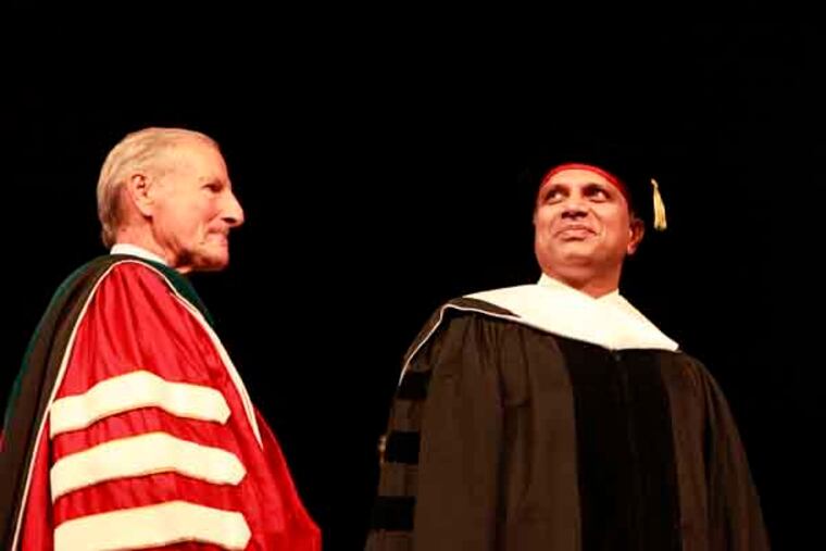 Keynote speaker and award recipient Pallam Raju acknowledges graduates from Temple University's Fox School of Business at the Liacouras Center on May 16, 2013. (Hillary Petrozziello / Staff Photographer)