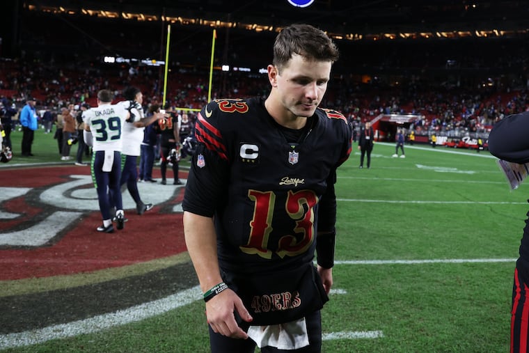 San Francisco 49ers quarterback Brock Purdy walks off the field after Saturday's loss to the Seahawks.