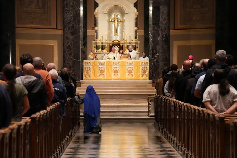 Archbishop Nelson J. Pérez celebrates Mass in honor of the newly chosen Pope Leo XIV, at the Cathedral Basilica of SS. Peter and Paul on Friday.