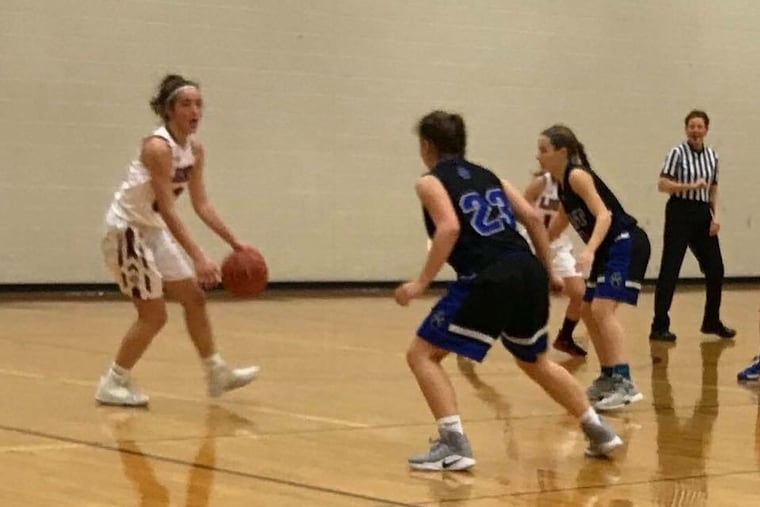 MaST Charter's Allyson Holtz and Katelyn Fowler play defense.