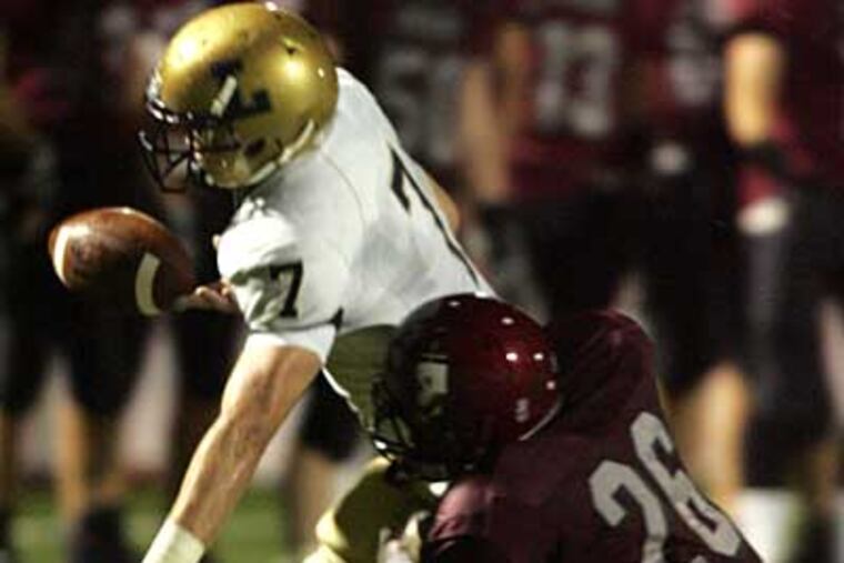 St. Joseph Prep's Jared Alwan tackles La Salle's Sam Feleccia. ( David Swanson / Staff Photographer )