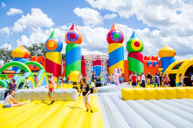 People of all ages bounce on the World's Biggest Bounce House.