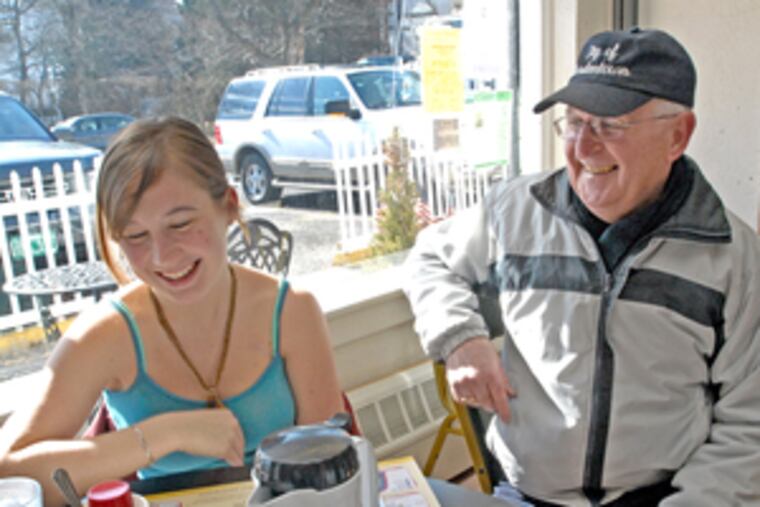 Bordentown City Mayor John W. Collom III with neighbor Courtney Sexton. He estimates the city's $4 million annual budget could lose nearly $500,000 in state aid.