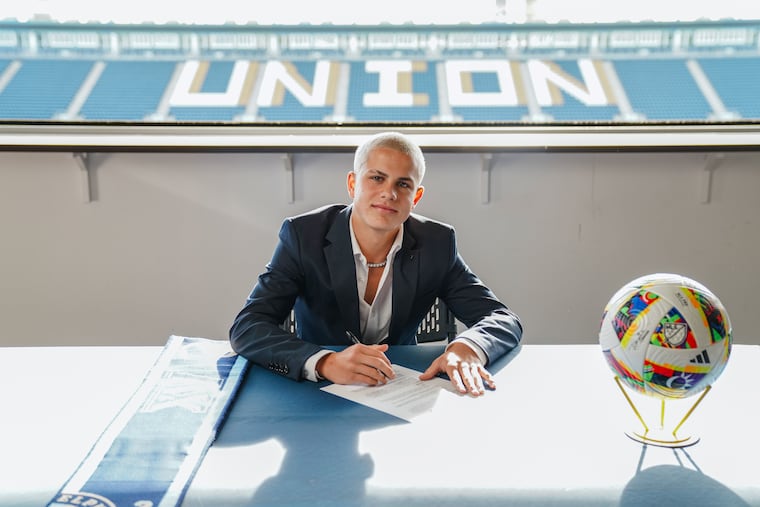 Cavan Sullivan poses while signing his Philadelphia Union first-team contract at Subaru Park in Chester earlier this month.