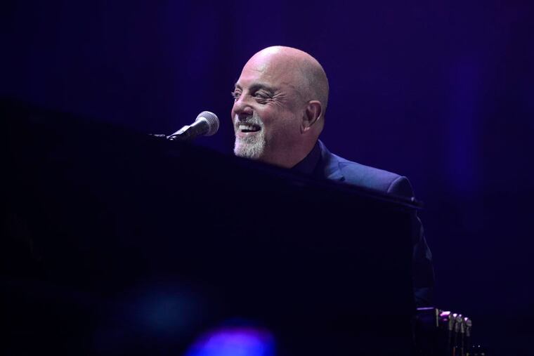 Billy Joel sings and plays the piano during his concert Aug. 13, 2015, at Citizens Bank Park. ( BEN MIKESELL / Staff Photographer )