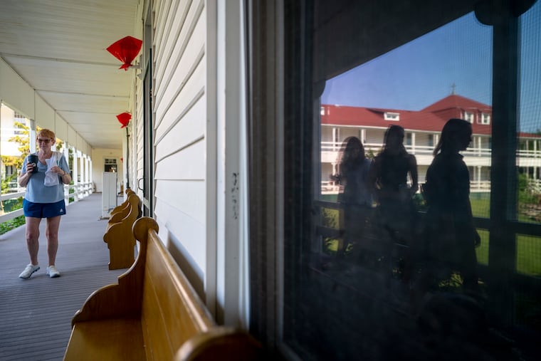 Mary Hildebrand is with other family members (reflected in the window) as they tour the newly formed nonprofit Cape May Point Science Center in Cape May Point, the environmental and research center in the former Saint Mary-by-the-Sea, the historic 138-bedroom retreat house of the Chestnut Hill-based Sisters of St. Joseph.