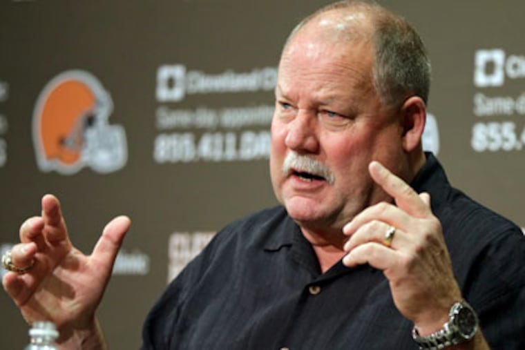 Cleveland Browns president Mike Holmgren answers questions during a news conference Tuesday. (Mark Duncan/AP)