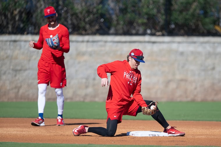 Phillies second baseman Bryson Stott, right, and new shortstop Trea Turner have developed a rapport in the early days of spring training.