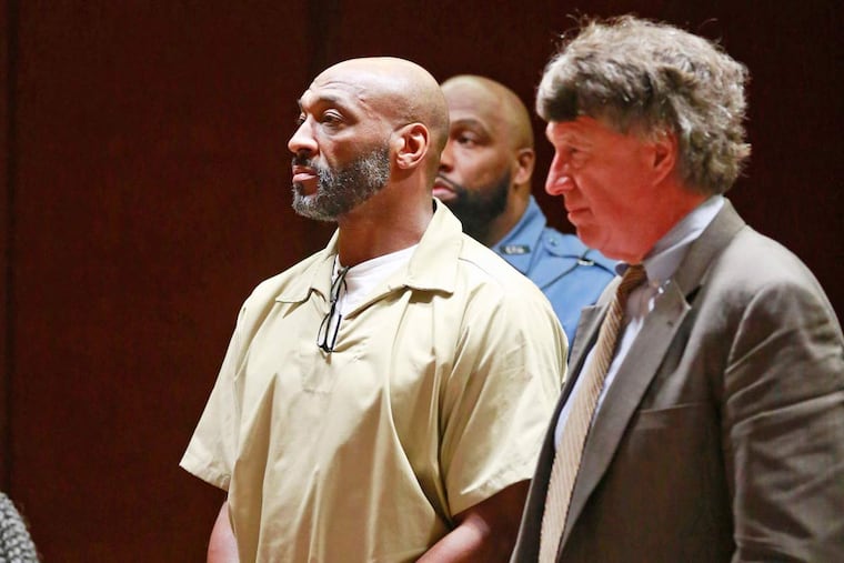 Irving Fryar appears in Burington County Courthouse, with his lawyer Michael Gilberti, to learn how much he pay back to the banks he defrauded in a mortgage scheme, December 7, 2015.