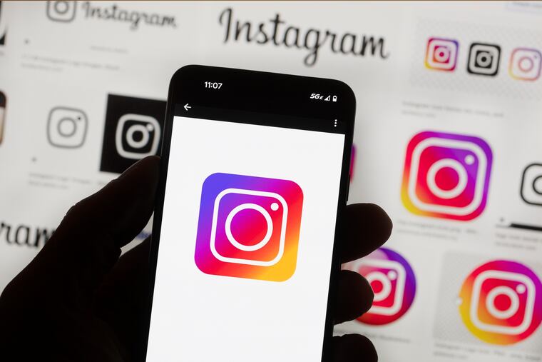 The Instagram logo is seen on a cell phone in Boston in 2022.