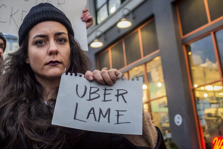 Dozens protest outside Uber's headquarters in Long Island City, the day before Uber CEO, Travis Kalanick, was to met with Donald Trump as part of his advisory council. Just prior to the protest's start, and after thousands deleted the ride-sharing service's app over the weekend, Kalanick announced he would not join Trump's advisory team. (Michael Nigro/Pacific Press/ ZUMA Wire/TNS)