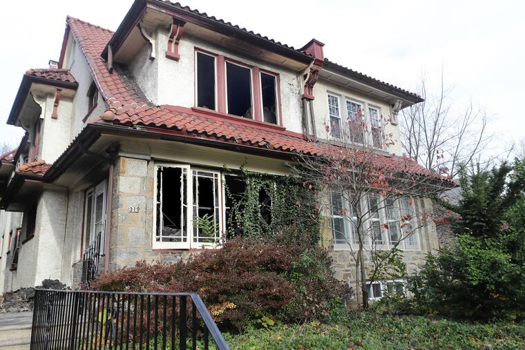 An exterior view of the home at 319 W. Mount Airy Ave. in Northwest Philadelphia after a 7-month-old boy and a 70-year-old woman died as a result of a fire Saturday night.