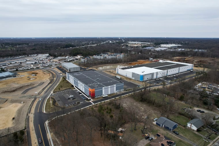 Large warehouses off of East Oak Lane in Lawnside, N.J. Some Lawnside residents are objecting to the increasing numbers of warehouses constructed in their community. The building on the upper right will be a fulfillment center for RevZilla, a Philadelphia company that sells motorcycle tires, helmets, gear, and other accessories. The building to the left will be the corporate offices of and a training center for IBC, a firm owned by Rheem Manufacturing Co., which makes boilers and HVAC equipment.