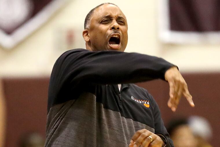 Head Coach Keith Taylor of Chester argues a call during their game against Lower Merion in a District 1 6A boys basketball playoff game.
