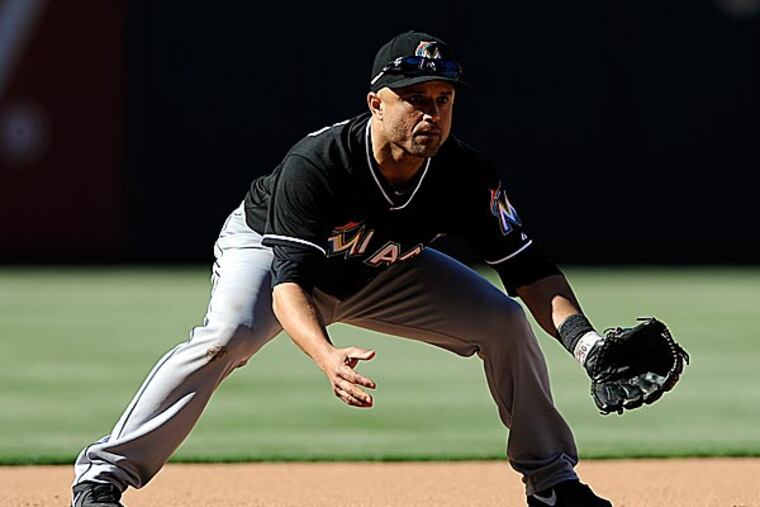 A teammate of Roy Halladay for three seasons, Placido Polanco says he is pulling for the Phillies righthander. (Michael Perez/AP)