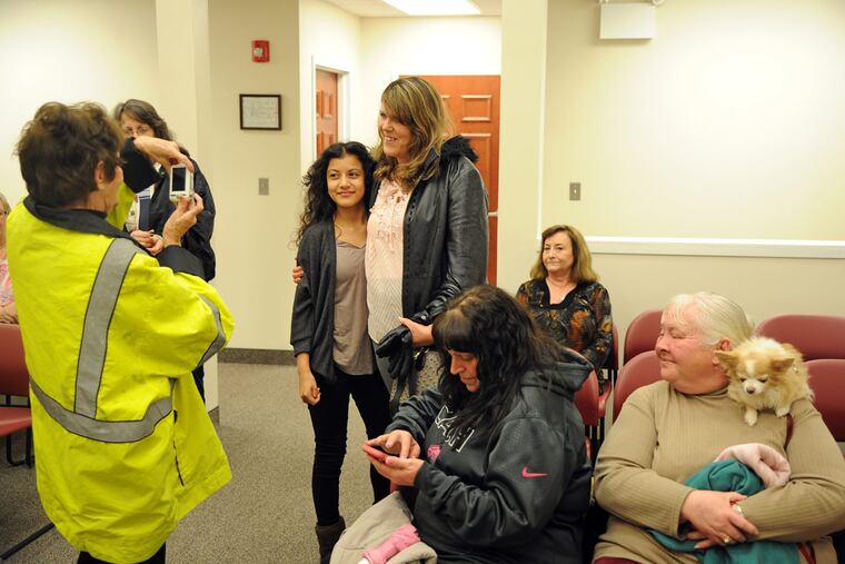 Carol Saler (center right) was hurt when struck by a car in an effort to protect Galilea Leiva (center left). Guard Gail Conway took their picture.