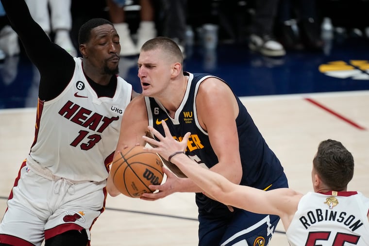 The Nuggets' Nikola Jokic had a game-high 41 points, but Miami and Bam Adebayo (left) evened the series in Game 2 on Sunday.