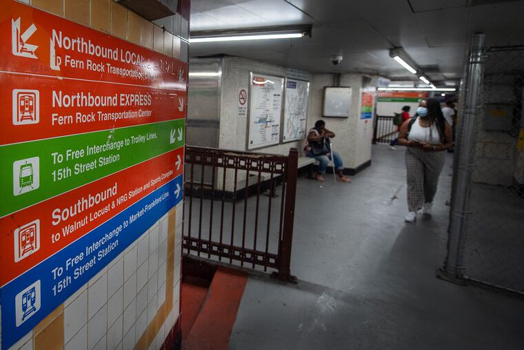 Signs on the South City Hall SEPTA station.