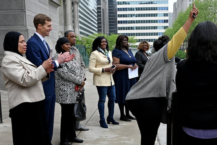 U.S. Rep. Conor Lamb, second from left, a Pennsylvania Democratic Senate candidate, outside Philadelphia City Hall on Wednesday as Darisha K. Parker, right, encourages abortion rights supporters to vote. They appeared at a National Organization for Women news conference in support of abortion access and Lamb's campaign.