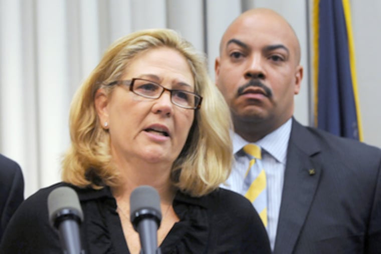 Maureen Faulkner, widow of Officer Daniel Faulkner, who was slain in 1981, with District Attorney Seth Williams last week. (Sarah J. Glover / Staff Photographer)
