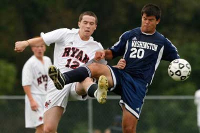 Archbishop Ryan's Marc Vogelman, left, shown here in an earlier game with Washington's Alex Sharufutdinov, scored yesterday as the Raiders advanced to the Catholic League playoffs. ( Ron Cortes / Staff Photographer )