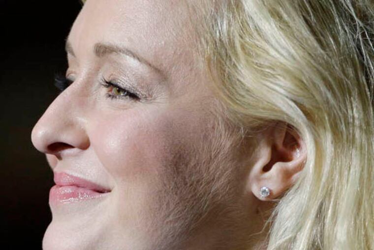 FILE - This Nov. 14, 2008 file photo shows country singer Mindy McCready performsingin Nashville, Tenn. Family and friends have gathered for the funeral of country music star Mindy McCready in her Florida hometown. About 200 were present Tuesday, Feb. 26, 2013, at the Crossroads Baptist Church. McCready's music played in the background and her image was shown on a large screen behind the altar. McCready, who hit the top of the country charts before personal problems sidetracked her career, died Sunday, Feb. 17. She was 37. (AP Photo/Mark Humphrey, File)