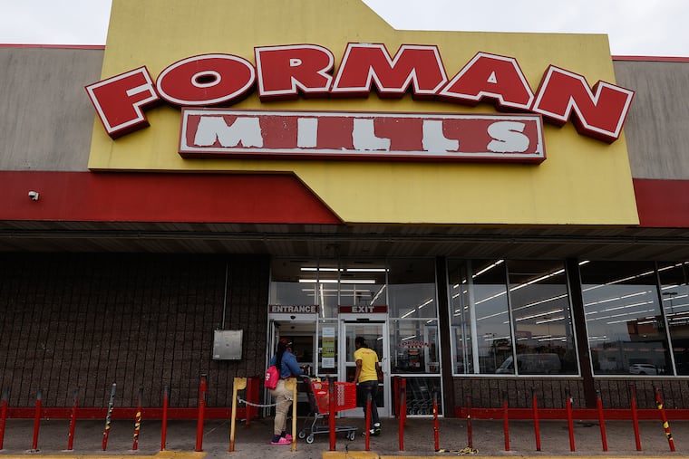 Forman Mills workers outside the store on Aramingo Avenue in Port Richmond on Thursday, June 22, 2023. Forman Mills, the New Jersey-based retail discount store, has avoided a bankruptcy by finding a buyer for the company.