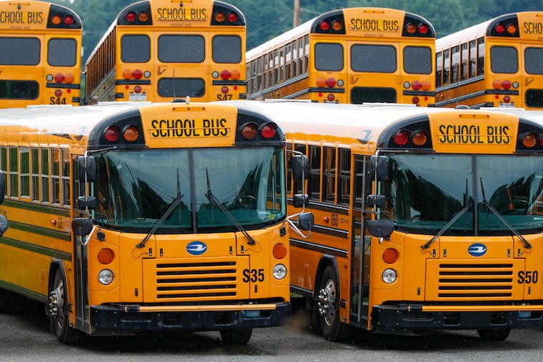 Rows of school buses are parked at their terminal in Zelienople, Pa. Pennsylvania schools are working on how they will safely transport students this fall, but one idea that won't be part of the plan is to install plastic barriers around school bus drivers. The state Transportation Department rejected that idea recently, saying there wasn't evidence it'll make anyone safer.