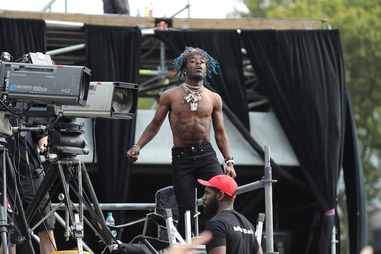 Lil Uzi Vert performs impromptu from the TV platform at the Rocky Stage at the Made in America festivities on the Parkway Saturday, September 3, 2016.