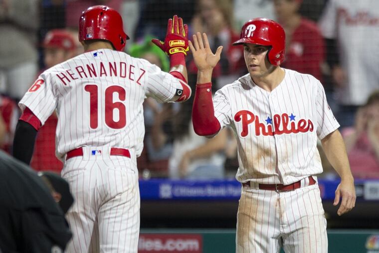 Cesar Hernandez high fives Scott Kingery after hitting a two-run home run in the fourth inning of the Phillies’ 11-0 win over San Francisco Monday.