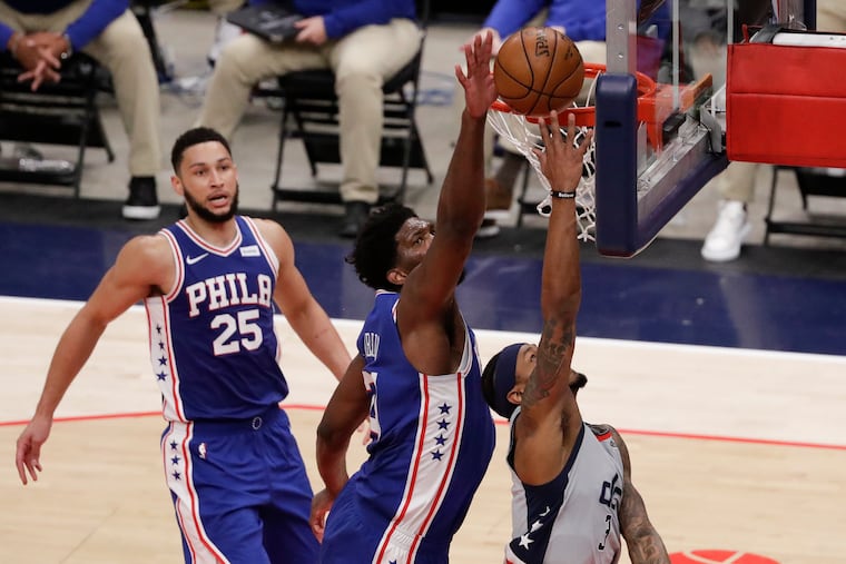 Sixers center Joel Embiid blocks Washington Wizards guard Bradley Beal's lay-up attempt during the third quarter in Game 3 of their first-round playoff series in Washington D.C., on Saturday, May 29, 2021.