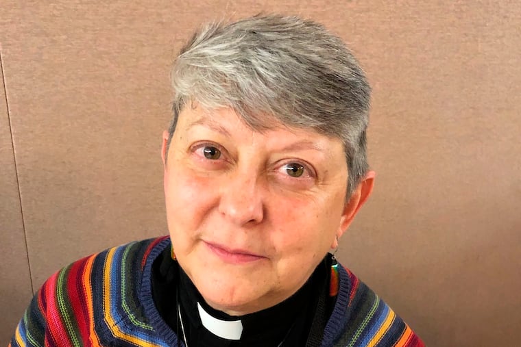 Lois McCullen Parr, 60, a United Methodist elder of Albion, Mich., poses for a picture at a national Methodist conference Monday, Feb. 25, 2019, in St. Louis. Nearly 900 delegates will decide whether America's second-largest Protestant denomination will fracture due to divisions over same-sex marriage and the ordination of LGBT clergy. Parr identifies as bisexual and queer and said no one should be left out of God's love. (AP Photo/Jim Salter)