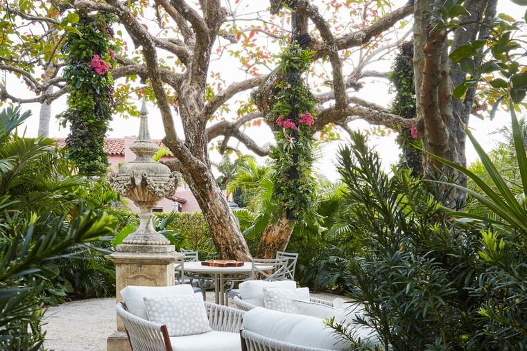 An outdoor space designed by landscape architect Robert Bell, who likes to use dense plantings to create privacy. They can also muffle sounds to help with noise control.