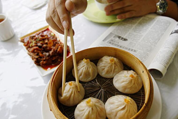Crab and pork "juicy buns," the delicate skins just firm enough to hold broth. (MICHAEL S. WIRTZ / Staff Photographer)