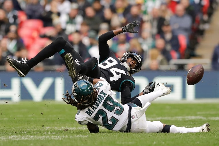 The Eagles could play in Germany this year. In this Oct. 28, 2018, photo, Jacksonville Jaguars wide receiver Keelan Cole is tackled by Eagles safety Avonte Maddox at Wembley Stadium in London, the last time the Eagles played in the international series.