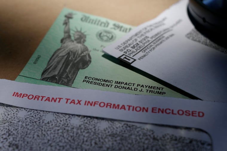 FILE - In this April 23, 2020, file photo, a stimulus check issued by the IRS to help combat the adverse economic effects of the COVID-19 outbreak. (AP Photo/Eric Gay, File)
