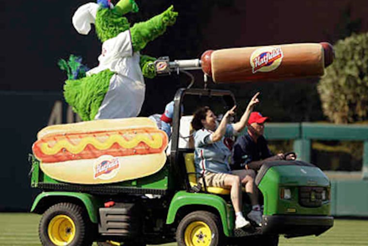 The Phanatic's hot dog launcher propels the franks with a tank of compressed nitrogen. The old launcher used carbon dioxide - inferior for repeated firing. (Yong Kim / Staff)
