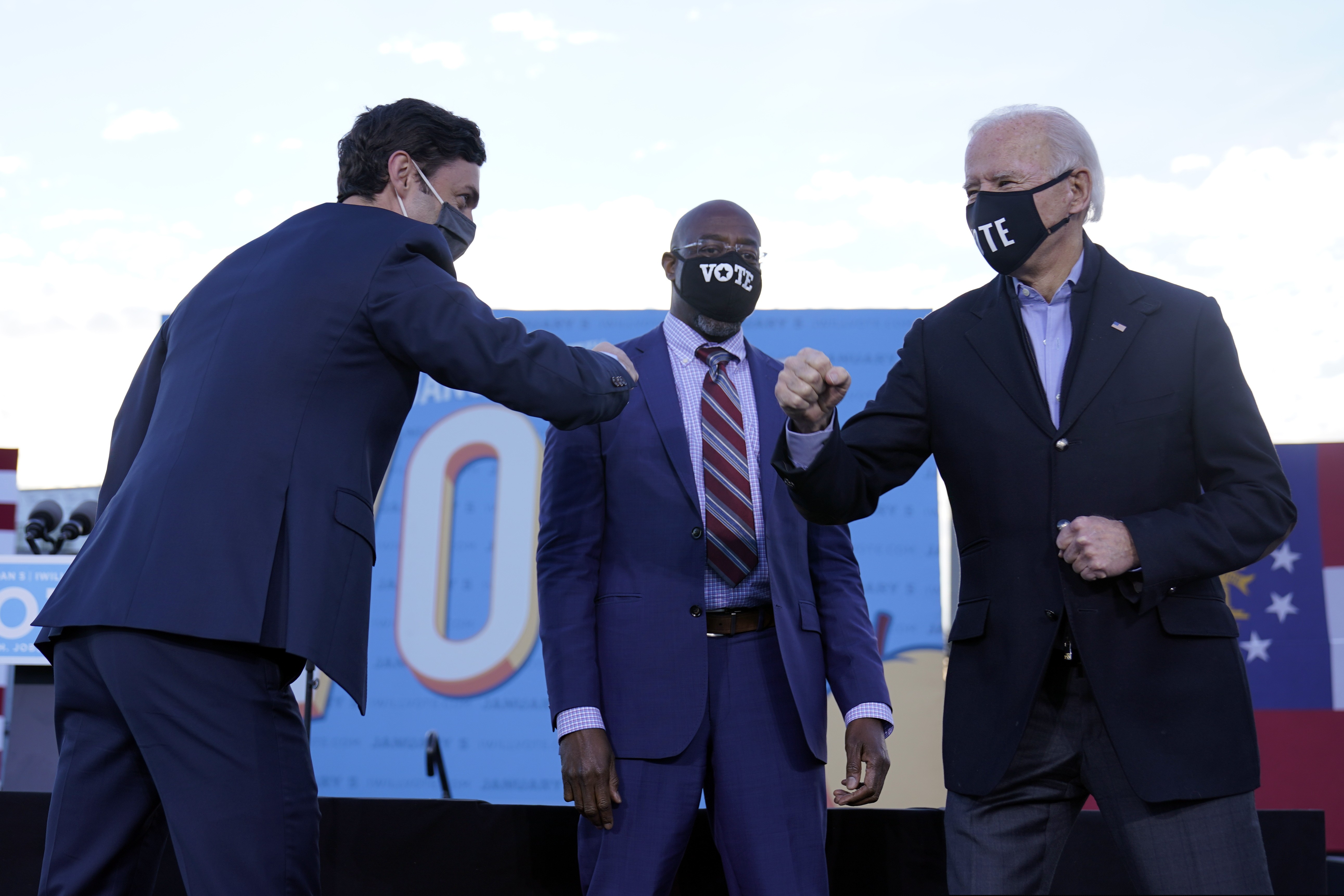 President-elect Joe Biden campaigned in Atlanta on Jan. 4 for then-Senate candidates Raphael Warnock, center, and Jon Ossoff, left.