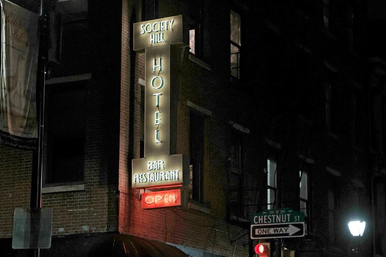 Mike Cangi raises the blinds in a fourth-floor hotel room that features exposed original ceiling beams at the newly renovated/restored Society Hill Hotel in Philadelphia on Thursday, May 9, 2024.
