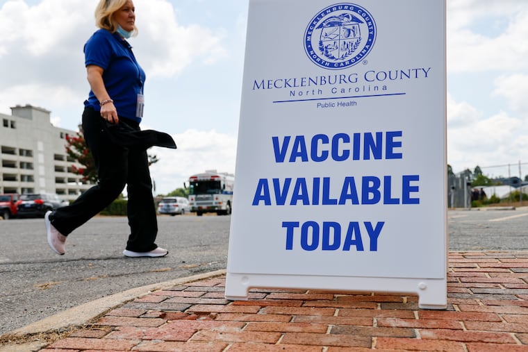 A Mecklenburg County Public Health employee arrives at a monkeypox vaccine clinic in Charlotte, N.C., Saturday, Aug. 20, 2022.