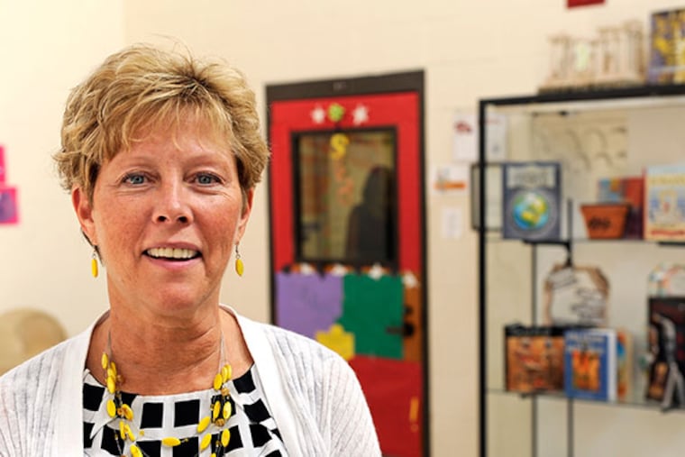 Kathleen Assini is the 2013-2014 New Jersey Teacher of the Year. She is seen here outside her classroom at Delsea Regional Middle School. ( TOM GRALISH / Staff Photographer )