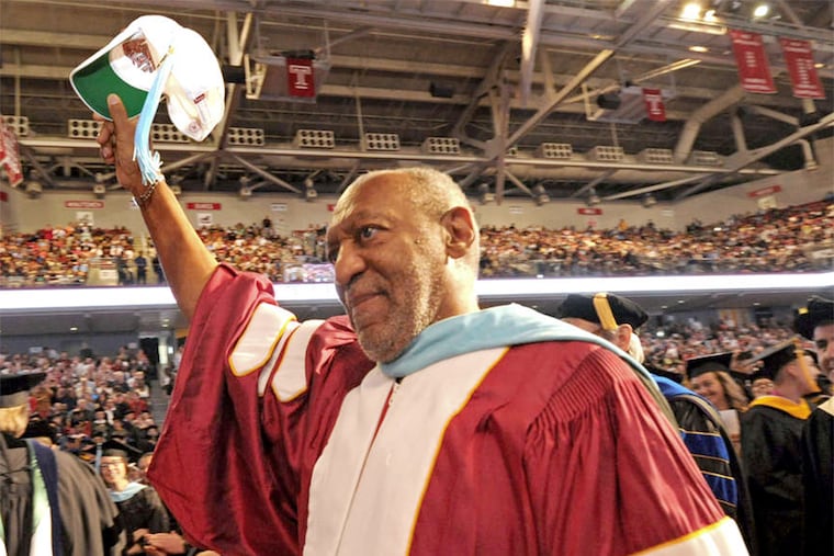 Bill Cosby doffs his hat at Temple University's May 2013 graduation. The comedian resigned from Temple University's board of trustees, a seat he has held for 32 years.