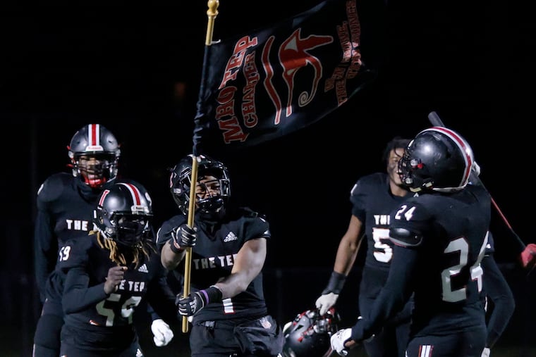 Imhotep Charter players celebrate after the Imhotep Charter vs. Roman Catholic football PIAA Class 5A playoff game at the Northeast Supersite on Nov. 19, 2022.