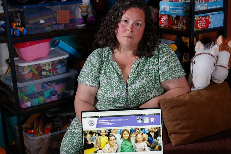 Alair Southerton pictured at her home with the Phoenixville Area School District website on her laptop. Southerton, whose children are 6 and 4, is leading a group of Phoenixville parents who are calling on their district to reduce screen time in school.