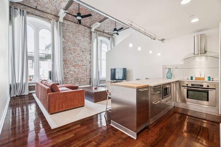 The kitchen and living space in the Center City condo.